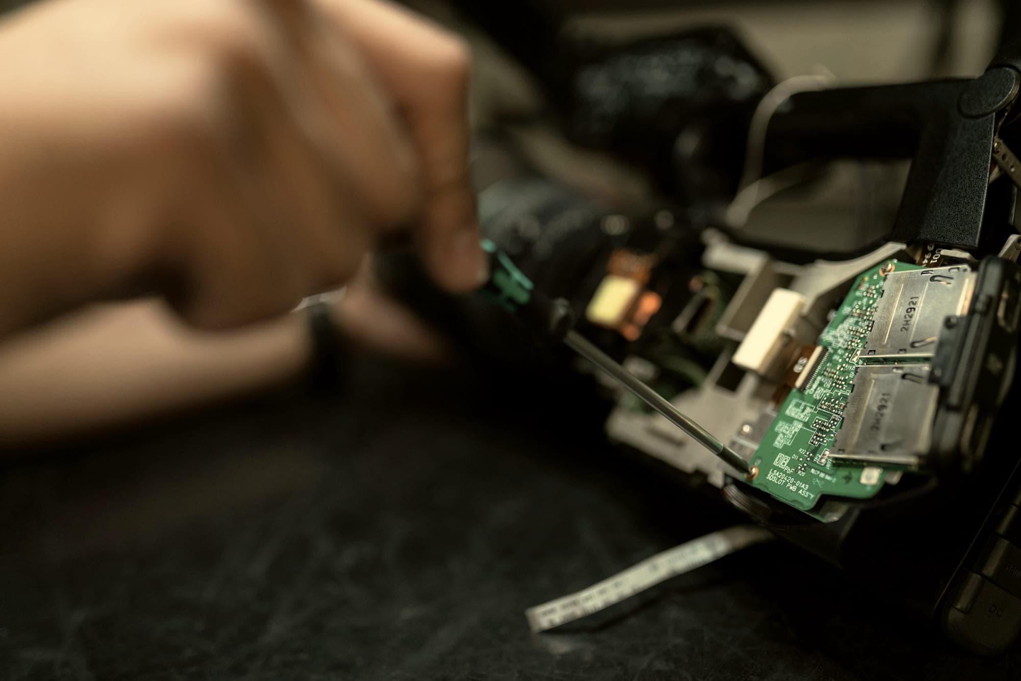 Close work by hand on a piece of precision equipment